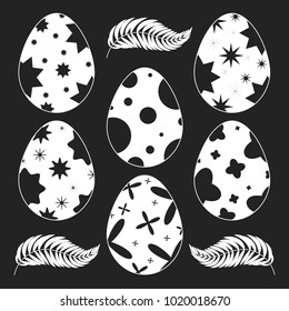 Set of isolated Easter eggs on a black background. With an abstract pattern. Simple flat vector illustration. Suitable for decoration of postcards, advertising, magazines, websites.