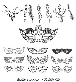 Set of isolated festive black hand drawn mask silhouette on the white background with feathers and leaves for decoration. Great elements for carnival party invitation or card. Mardi Gras masks.