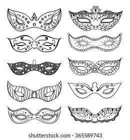 Set of isolated festive black hand drawn mask silhouette on the white background. Great elements for carnival party invitation or card. Mardi Gras masks.