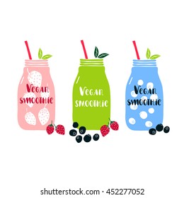 Set of isolated mason jar with lettering Vegan smoothie. Decorated with strawberry and blueberry. Healthy food concept.
