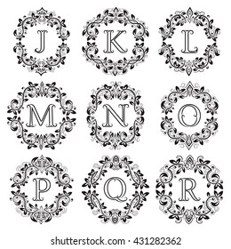 Set of isolated monograms in floral wreath. The letters are surrounded by ornamental elements.