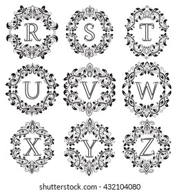 Set of isolated monograms in floral wreath. The letters are surrounded by ornamental elements.