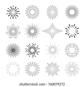 Set of isolated sunburst rays design elements on a black background.