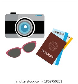 A set of items for travel: a camera, glasses and a passport with tickets