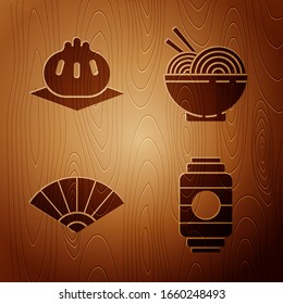 Set Japanese paper lantern, Khinkali on cutting board, Paper chinese or japanese folding fan and Asian noodles in bowl and chopsticks on wooden background. Vector
