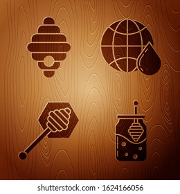 Set Jar of honey and honey dipper stick, Hive for bees, Honey dipper stick and Honeycomb map of the world on wooden background. Vector