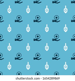 Set Jewish coin on hand and Hanukkah dreidel on seamless pattern. Vector