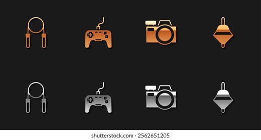 Set Jump rope, Gamepad, Photo camera and Whirligig toy icon. Vector