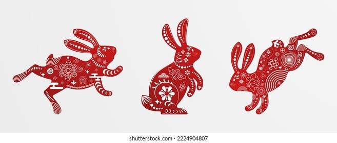 Set of jumping and sitting rabbit. Zodiac animals with traditional Chinese pattern. Happy Chinese New Year. Spring Festival and Easter holiday decoration. Paper cut style. Flat vector illustration.
