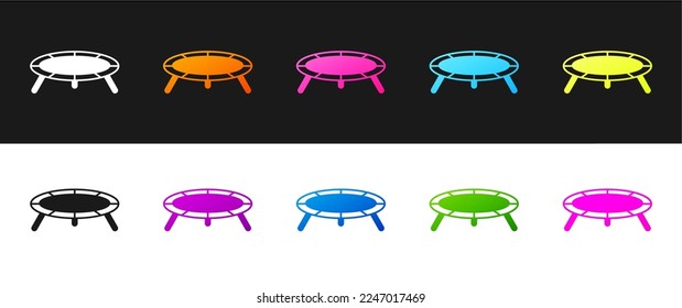 Set Jumping trampoline icon isolated on black and white background.  Vector