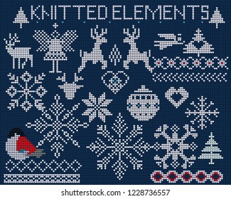  Set of knitted elements, ornaments, snowflakes and other Christmas decoration on blue background