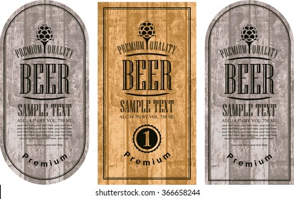 set labels for beer in a retro style with malt against the backdrop of wooden planks