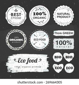 set of labels for eco food and organic products drawn with chalk on a blackboard