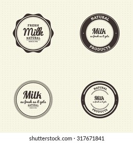 Set of labels with text and icons for milk products