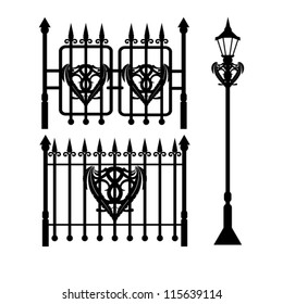 set of lantern, wrought iron fence and gate