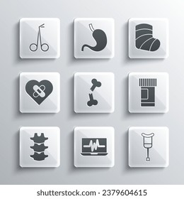 Set Laptop with cardiogram, Crutch or crutches, Medicine bottle and pills, Human broken bone, spine, Healed heart, Medical scissors and Gypsum icon. Vector