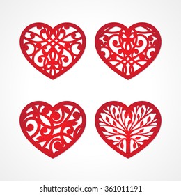 Set of laser cut heart labels. Die cut heart shapes with swirl. Swirly heart shapes for Valentine's Day. Red heart for Valentine paper card. Paper heart with swirls. Floral heart. Heart decoration.