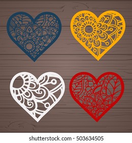 Set of laser cut heart labels. Die cut heart shapes with swirl. Swirly heart shapes for Valentine's Day. Red heart for Valentine paper card. Paper heart with swirls. Floral heart. Heart decoration.