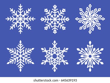 Set of laser cutting openwork snowflakes. Vector silhouette of christmas decoration. Template for paper isolated on blue background. Stencil for scrapbooking, carved wood.