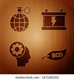 Set Leaf Eco symbol, Planet earth and a recycling, Human head with gear inside and Car battery on wooden background. Vector