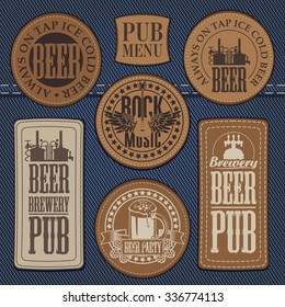 set of leather labels on denim on the theme pub with live music