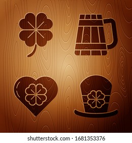 Set Leprechaun hat and four leaf clover, Four leaf clover, Heart with four leaf clover and Wooden beer mug on wooden background. Vector