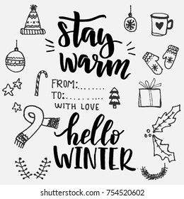 Set of lettering phrases Hello winter and Stay Warm with winter handdrawn doodles: scarf, hat, cup ect. Vector doodles and winter lettering.