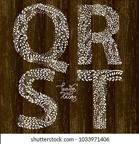 Set of letters Q, R, S, T made with hand drawn leaves, on wooden background. Vector illustration, part of collection. Letters and background are on separate layers