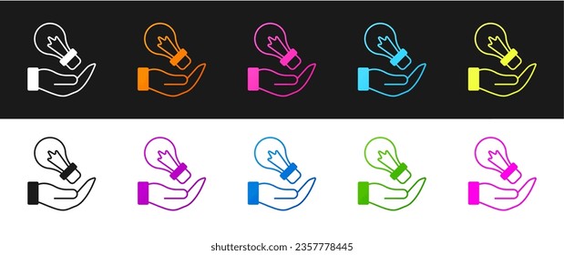 Set Light bulb in hand with concept of idea icon isolated on black and white background. Energy and idea symbol. Inspiration concept.  Vector