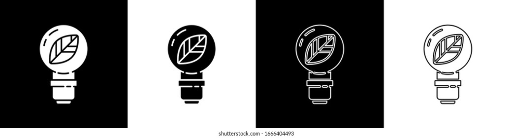Set Light bulb with leaf icon isolated on black and white background. Eco energy concept. Alternative energy concept.  Vector Illustration