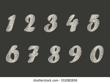 Set of light golden numbers on dark grey background