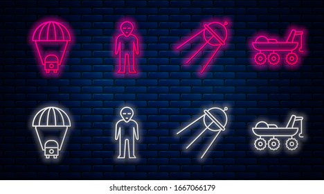 Set line Alien, Satellite, Planet Saturn and Mars rover. Glowing neon icon on brick wall. Vector