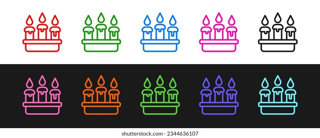 Set line Burning candle in candlestick icon isolated on black and white background. Cylindrical candle stick with burning flame.  Vector
