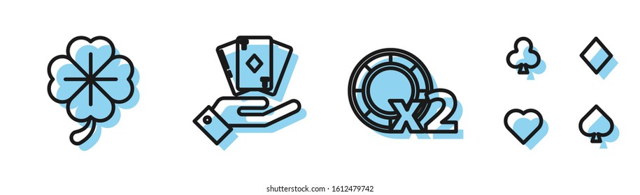 Set line Casino chips, Four leaf clover, Hand holding deck of playing cards and Playing cards icon. Vector