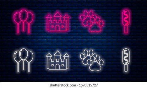 Set line Castle, Paw print, Balloons with ribbon and Corn dog. Glowing neon icon on brick wall. Vector