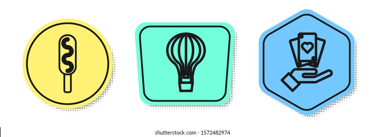 Set line Corn dog, Hot air balloon and Hand holding playing cards. Colored shapes. Vector