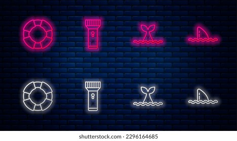 Set line Flashlight, Whale tail in ocean wave, Lifebuoy and Shark fin. Glowing neon icon on brick wall. Vector