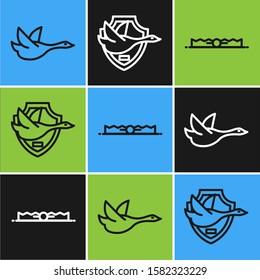Set line Flying duck, Trap hunting and Flying duck on shield icon. Vector