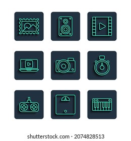 Set line Gamepad, Bathroom scales, Music synthesizer, Play Video, Photo camera, Online play video, Postal stamp and Stopwatch icon. Vector