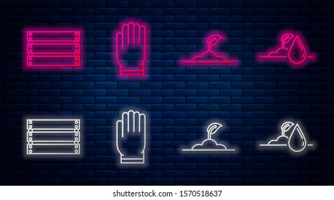 Set line Garden gloves, Sprout, Wooden box and Watering sprout. Glowing neon icon on brick wall. Vector
