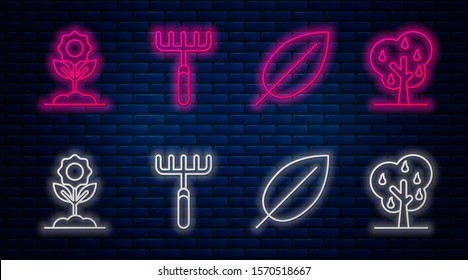 Set line Garden rake, Leaf, Flower and Tree with pears. Glowing neon icon on brick wall. Vector