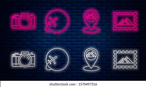 Set line Globe with flying plane, Map pointer with Egypt pyramids, Photo camera and Postal stamp and Egypt pyramids. Glowing neon icon on brick wall. Vector