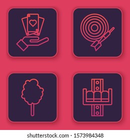 Set line Hand holding playing cards, Cotton candy, Classic dart board and arrow and Attraction carousel. Blue square button. Vector