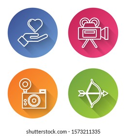 Set line Heart on hand, Cinema camera, Photo camera and Bow and arrow. Color circle button. Vector