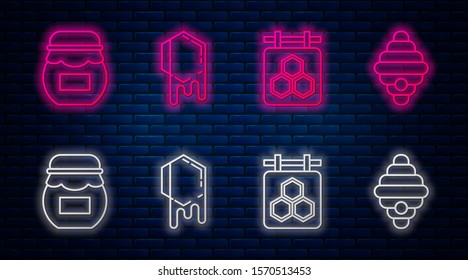 Set line Honeycomb, Hanging sign with honeycomb, Jar of honey and Hive for bees. Glowing neon icon on brick wall. Vector