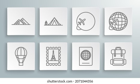 Set line Hot air balloon, Tourist tent with wood fire, Postal stamp and Eiffel tower, Passport biometric data, Hiking backpack, Globe flying plane,  and Egypt pyramids icon. Vector