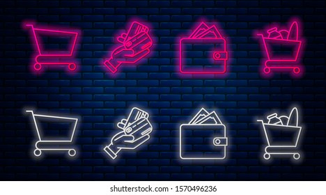 Set line Human hand holding with credit card, Wallet with stacks paper money cash, Shopping cart and Shopping cart and food. Glowing neon icon on brick wall. Vector