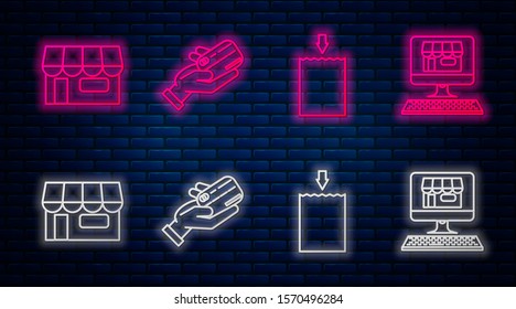 Set line Human hand holding with credit card, Paper shopping bag, Shopping building or market store and Shopping building on screen computer. Glowing neon icon on brick wall. Vector
