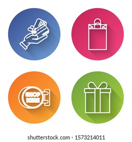 Set line Human hand holding with credit card, Paper shopping bag, Signboard hanging with an inscription shop here and Gift box. Color circle button. Vector