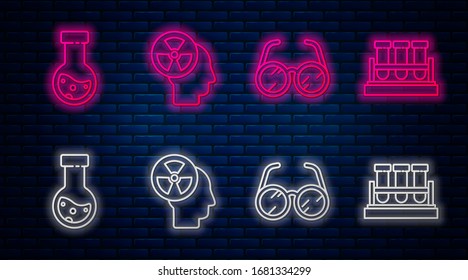 Set line Human head and a radiation, Laboratory glasses, Test tube and flask chemical and Test tube and flask chemical. Glowing neon icon on brick wall. Vector